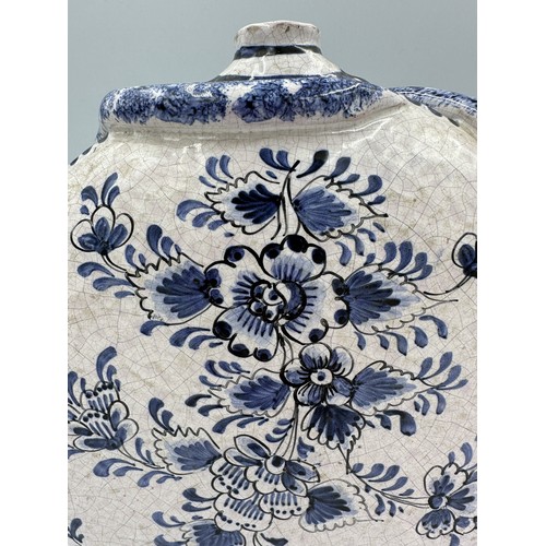 141 - A pair of 18thC Delft blue and white pottery moon flasks with applied coiled serpents to the side fi... 