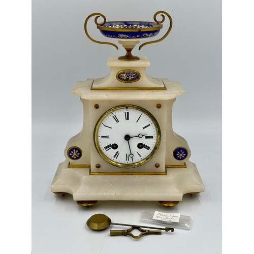 1264 - A French marble mantle clock with enamel decoration and movement signed D.C.&.Cie. Key and pendulum.... 