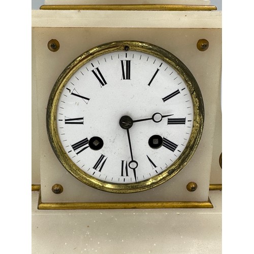 1264 - A French marble mantle clock with enamel decoration and movement signed D.C.&.Cie. Key and pendulum.... 