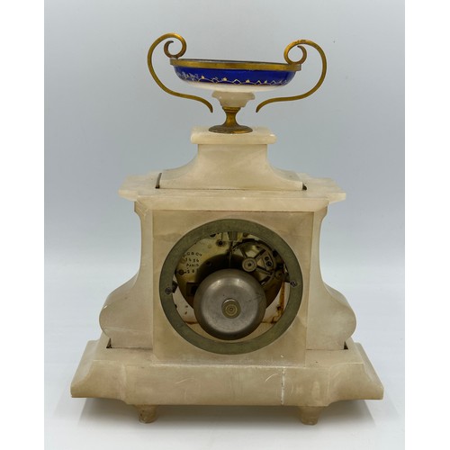 1264 - A French marble mantle clock with enamel decoration and movement signed D.C.&.Cie. Key and pendulum.... 