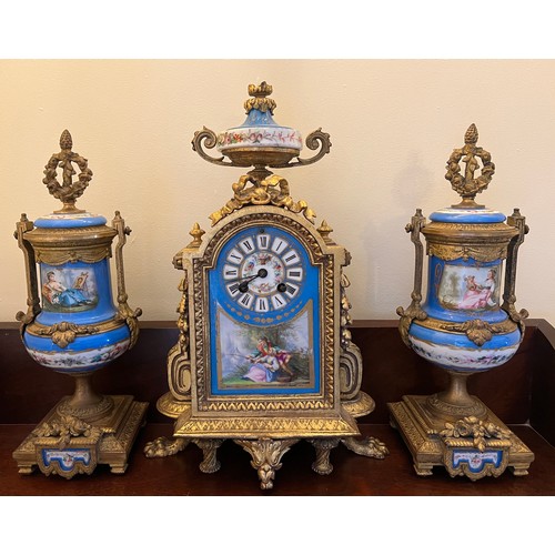 1265 - A French gilt metal mantle clock with a painted porcelain face, case back stamped  P.H. Mourey 74, h... 