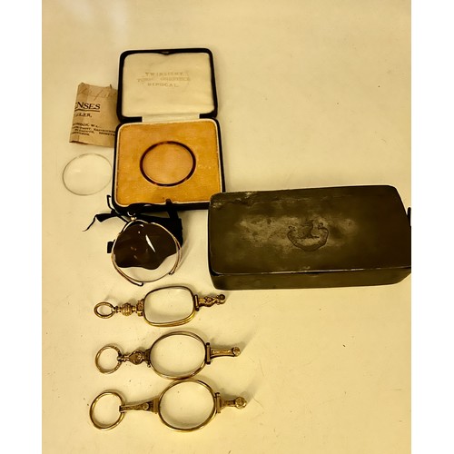 451 - Early 20thC glasses and lens contained within a 19thC pewter box with a boxed twinsight toric onepie... 