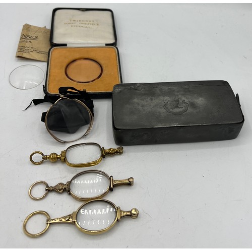 451 - Early 20thC glasses and lens contained within a 19thC pewter box with a boxed twinsight toric onepie... 