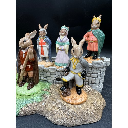 125 - A Royal Doulton Bunnykins Robin Hood collection and base, comprising of Prince John DB266, Maid Mari... 