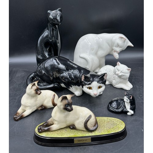 119 - A collection of ceramic cats to include two Beswick Siamese, 3 x Just Cats & Co etc. (7). Tallest bl... 