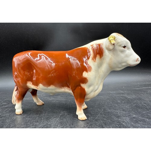 120 - Ceramic figurines to include: Beswick Hereford Bull and swan, 3 x Coopercraft Black Face sheep and a... 