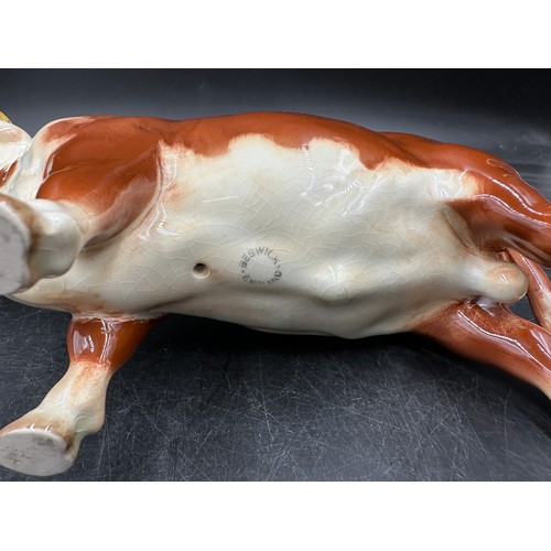 120 - Ceramic figurines to include: Beswick Hereford Bull and swan, 3 x Coopercraft Black Face sheep and a... 