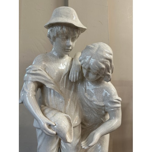 123 - Large 20thC ceramic figurine of two children at the seaside approx 91cm h.