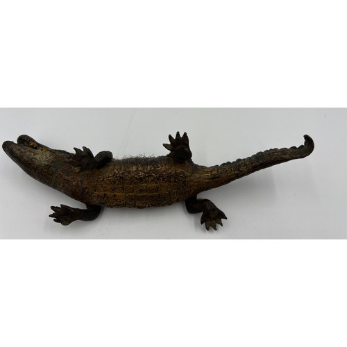 1320 - A 19thC cold painted bronze pen wipe in the form of an alligator. 22cm l.