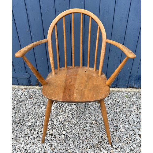 51 - A mid century Ercol carver chair with original blue paper label.