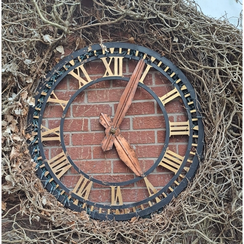 1262 - A very large wall mounted turret garden clock. 92cm d. Gillett & Co mechanism.