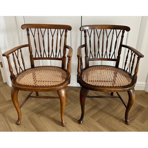55 - Two cane seated armchairs.