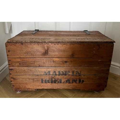 1144 - A pine lidded advertising box. Green’s chocolate mould. 42 h x 70 w x 38cm d.