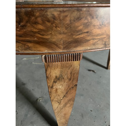 60 - A circular burr walnut dining table. 133cm d x 79cm h. The base with pull out mechanism but no extra... 