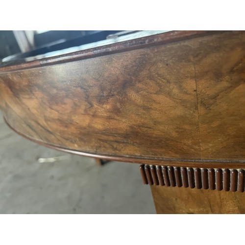 60 - A circular burr walnut dining table. 133cm d x 79cm h. The base with pull out mechanism but no extra... 