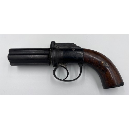 1209 - A pepper pot percussion cap six-shot pistol with walnut stock and engraved decoration.