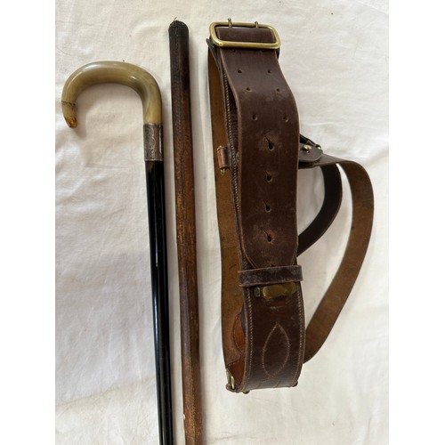 1210 - A WW1/WW2 British Sam Browne leather belt and an Officers swagger stick together with an ebony walki... 