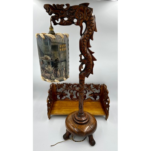 1154 - A Chinese carved wooden Dragon lamp and shade with a carved wooden folding bookstand.