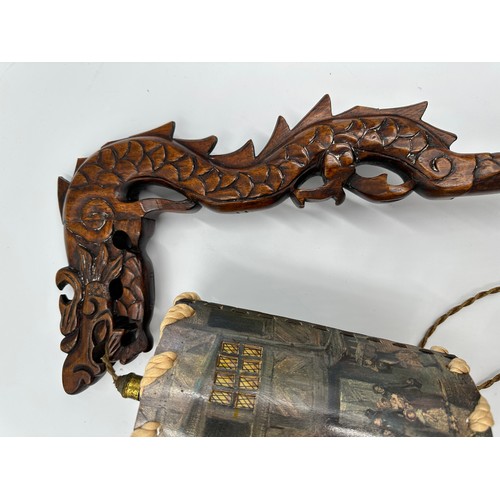 1154 - A Chinese carved wooden Dragon lamp and shade with a carved wooden folding bookstand.