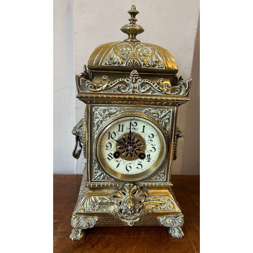 1268 - An ornate brass mantle clock with white enamel face. Presented to Lieut. D Blair by the NCO’s and me... 