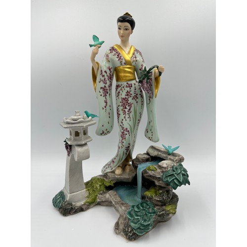 206 - A Franklin Mint porcelain figure modelled as Mariko, Princess of The Wisteria Blooms, designed by Ma... 