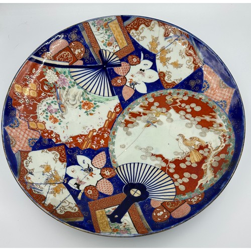 207 - Two large oriental Imari chargers, 56 and 45.5cm d.