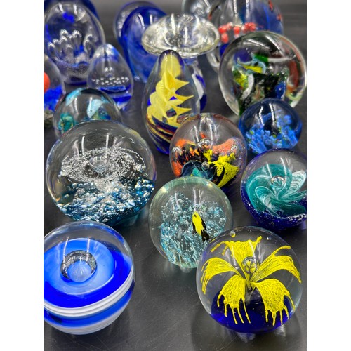 304 - An assortment of paper weights, majority blue, various shapes and sizes, 5 depicting fish, to includ... 