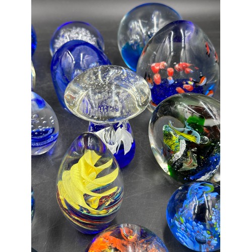 304 - An assortment of paper weights, majority blue, various shapes and sizes, 5 depicting fish, to includ... 