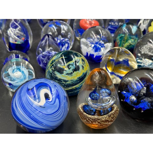 304 - An assortment of paper weights, majority blue, various shapes and sizes, 5 depicting fish, to includ... 