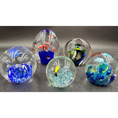 304 - An assortment of paper weights, majority blue, various shapes and sizes, 5 depicting fish, to includ... 