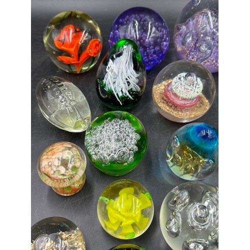 313 - A large collection of paper weights, various colours, shapes and sizes named ones to include T.V.G.,... 