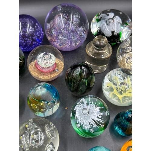 313 - A large collection of paper weights, various colours, shapes and sizes named ones to include T.V.G.,... 