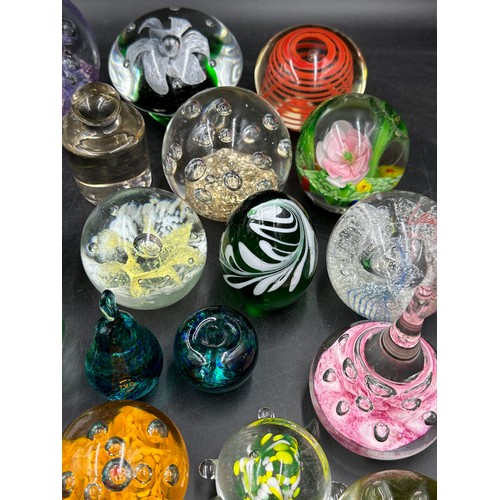 313 - A large collection of paper weights, various colours, shapes and sizes named ones to include T.V.G.,... 