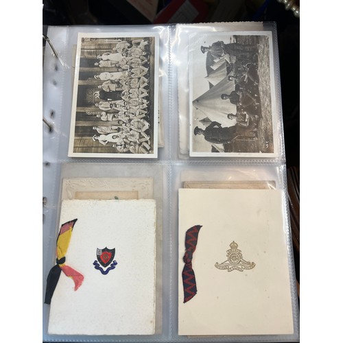 1215 - An album containing multiple postcards including WW1 and  WW1 silk postcards, funeral notices etc.