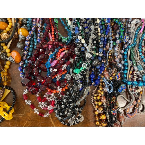 348 - A large quantity of good quality vintage bead necklaces to include glass, jet, resin etc.