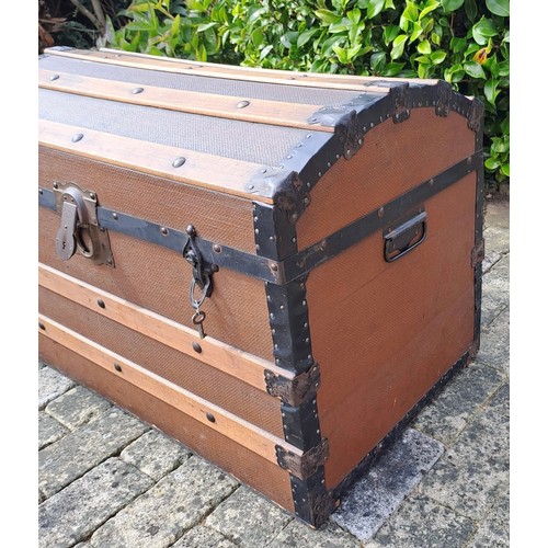 66 - A vintage wood and metal bound trunk. 53cm h x 76cm w x 45cm d