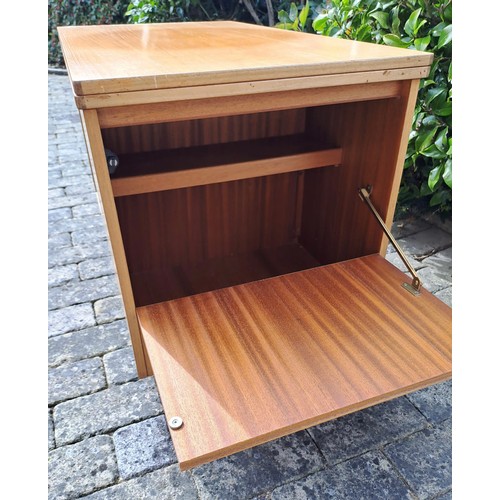 71 - A mid century coffee table with two nesting tables, and foldover top and a cupboard to one end. 56 h... 