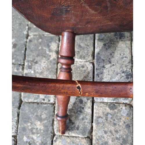 72 - A 19thC ash and elm child’s Windsor chair with crinoline stretcher. 60cm h x 35cm w x 26cm d.