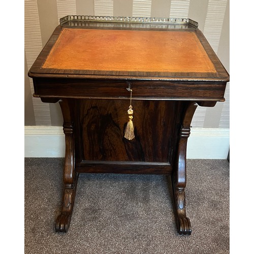 62 - A 19thC rosewood Davenport desk with tooled leather top and door to one side opening to reveal three... 