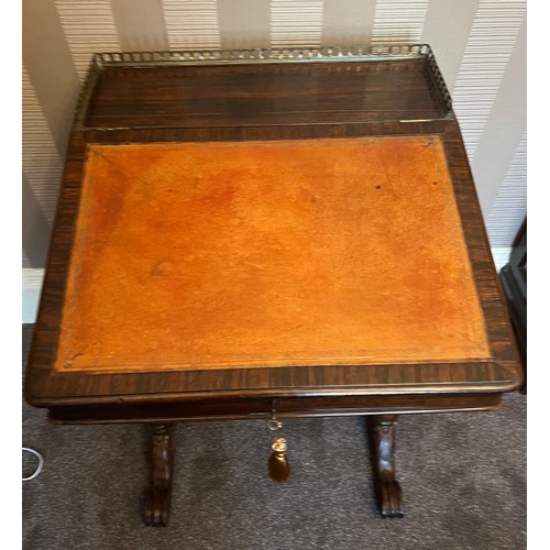 62 - A 19thC rosewood Davenport desk with tooled leather top and door to one side opening to reveal three... 