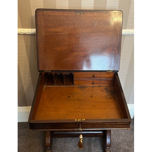 62 - A 19thC rosewood Davenport desk with tooled leather top and door to one side opening to reveal three... 