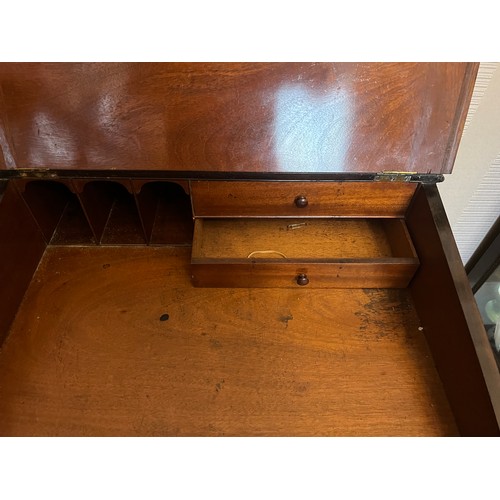 62 - A 19thC rosewood Davenport desk with tooled leather top and door to one side opening to reveal three... 