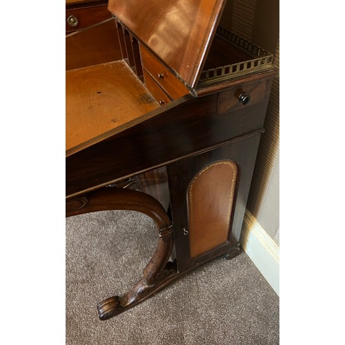 62 - A 19thC rosewood Davenport desk with tooled leather top and door to one side opening to reveal three... 