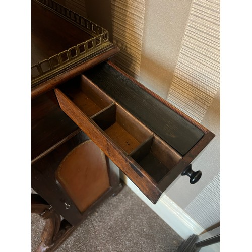 62 - A 19thC rosewood Davenport desk with tooled leather top and door to one side opening to reveal three... 