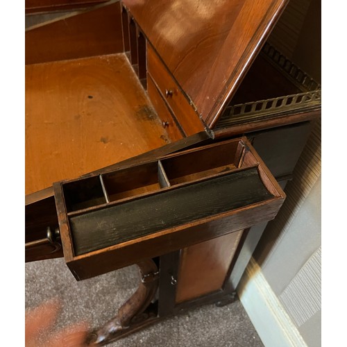 62 - A 19thC rosewood Davenport desk with tooled leather top and door to one side opening to reveal three... 