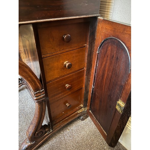 62 - A 19thC rosewood Davenport desk with tooled leather top and door to one side opening to reveal three... 