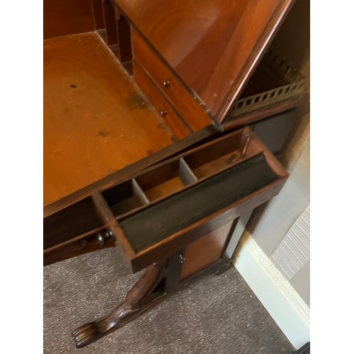 62 - A 19thC rosewood Davenport desk with tooled leather top and door to one side opening to reveal three... 