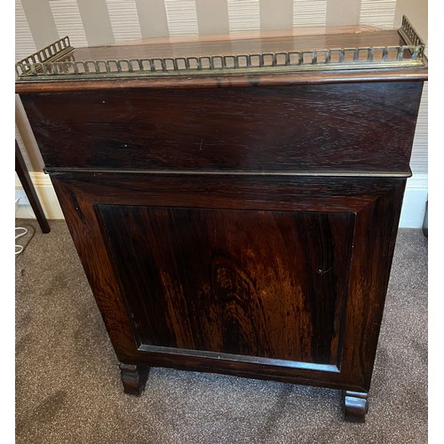 62 - A 19thC rosewood Davenport desk with tooled leather top and door to one side opening to reveal three... 