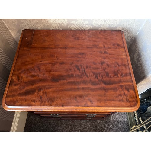 63 - A 19thC mahogany commode with brass handles and two false drawers to front. 68cm w x 52cm d x 69cm h... 