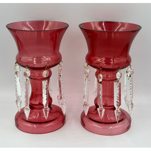 315 - A pair of cranberry glass lustres 25.5cm h together with a peach opaque hand holding vase and a yell... 